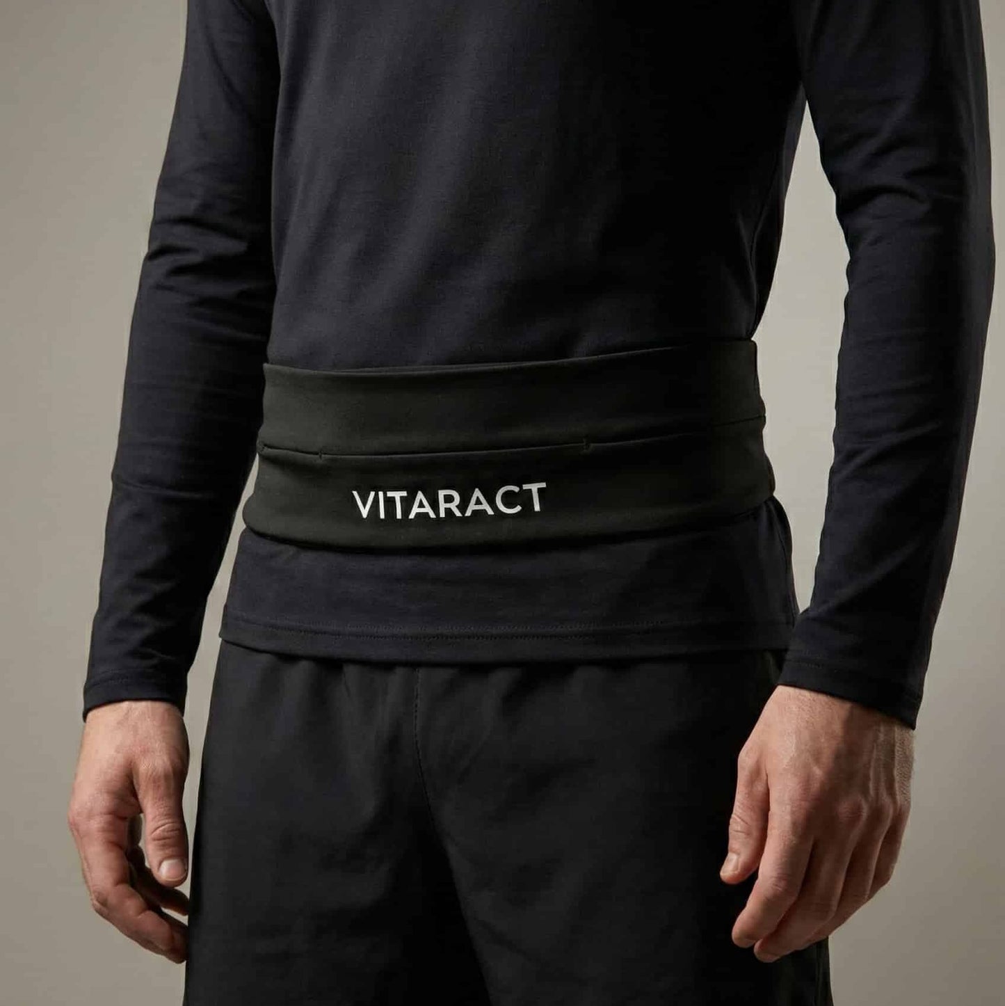 Vitaract bounce-free running belt holding iPhone Pro Max and keys lebanon