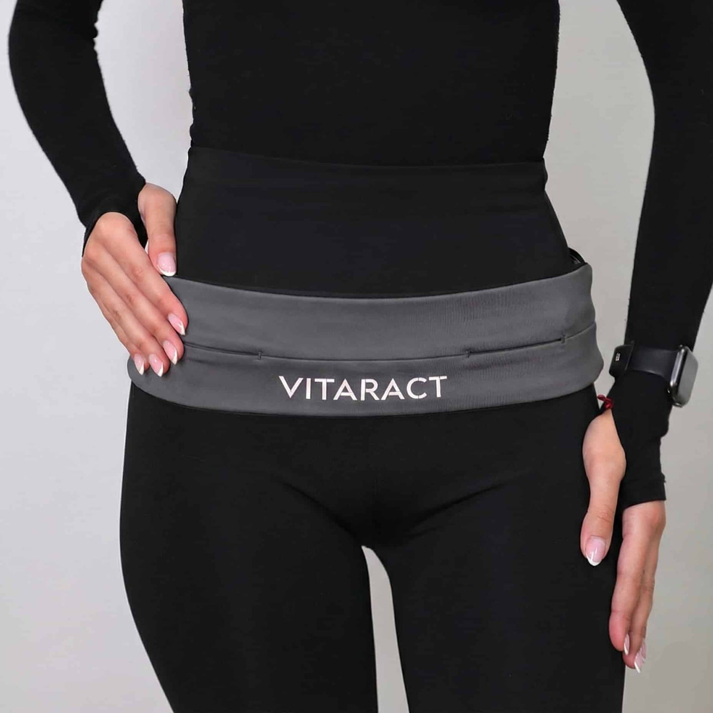 Vitaract bounce-free running belt holding iPhone Pro Max and keys lebanon